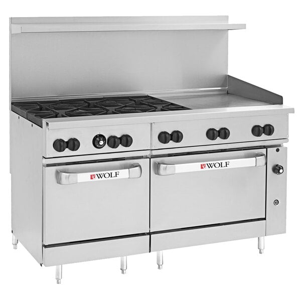 A Wolf stainless steel commercial range with 6 burners, a griddle, and 2 ovens.