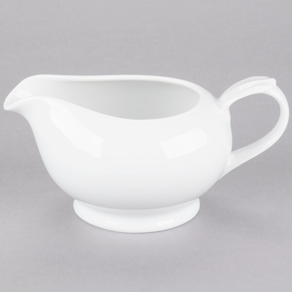 A white 10 Strawberry Street porcelain gravy boat with a handle.