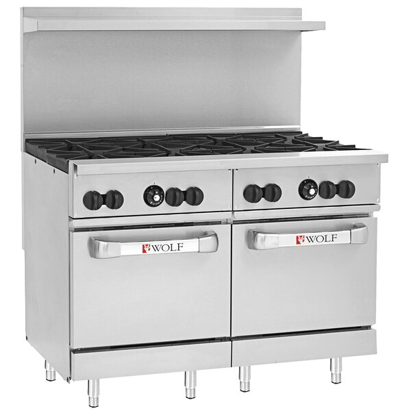 A large stainless steel Wolf commercial gas range with 8 burners and 2 ovens.