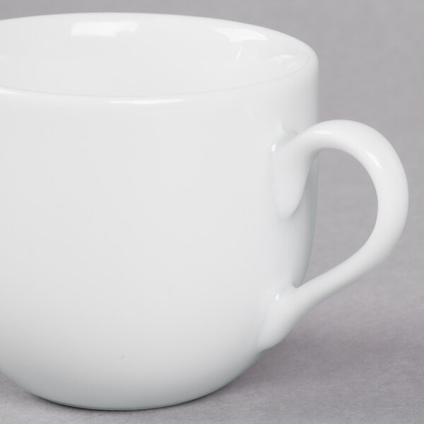 A 10 Strawberry Street white porcelain espresso cup with a saucer.