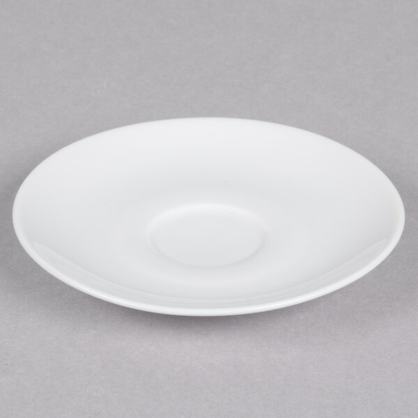 A white porcelain saucer with a circular shape.