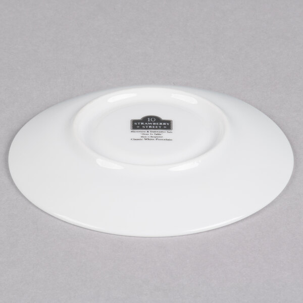 A white porcelain 10 Strawberry Street espresso cup and saucer.