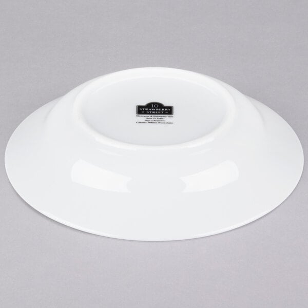 A white porcelain soup bowl with a black label reading "10 Strawberry Street"