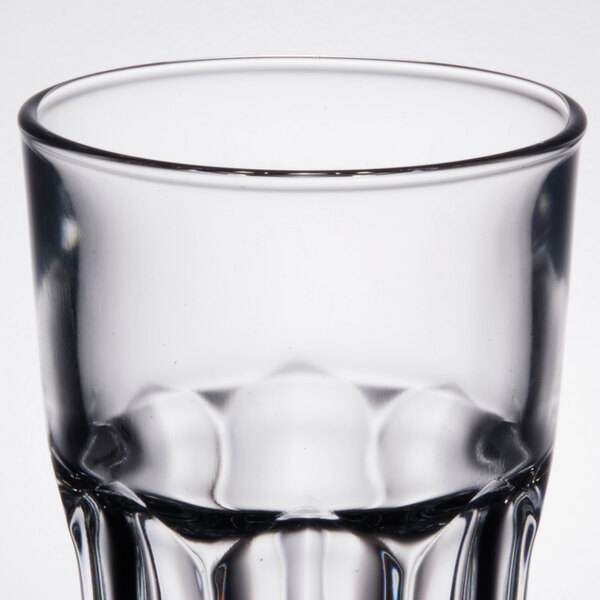 An Arcoroc stackable cooler glass with a pattern on it.