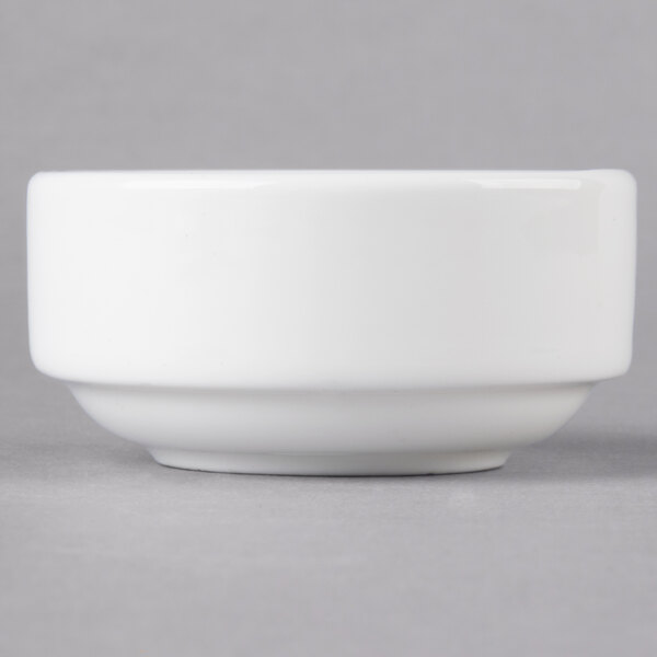 A 10 Strawberry Street white porcelain ramekin on a grey surface.