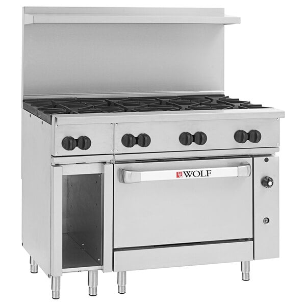 A large stainless steel Wolf commercial gas range on a counter.