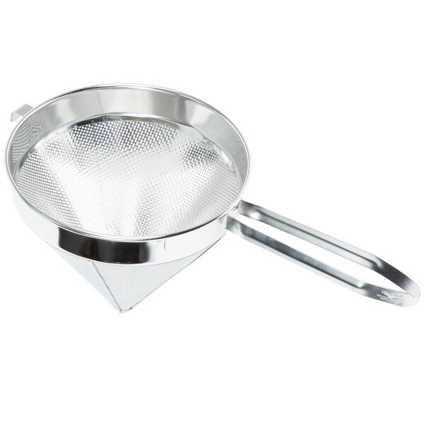 A Vollrath stainless steel sieve with a handle.