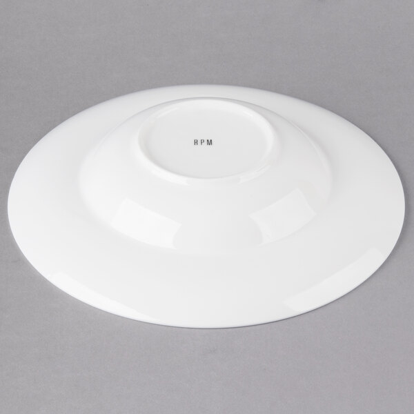 A white round porcelain bowl with a rim.