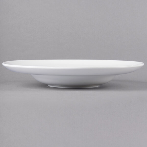 A close up of a white 10 Strawberry Street Ricard porcelain pasta bowl.
