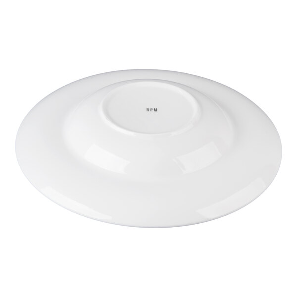 A white round porcelain pasta bowl shown upside down.