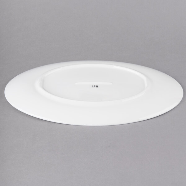 A white oval porcelain platter with a circular edge.