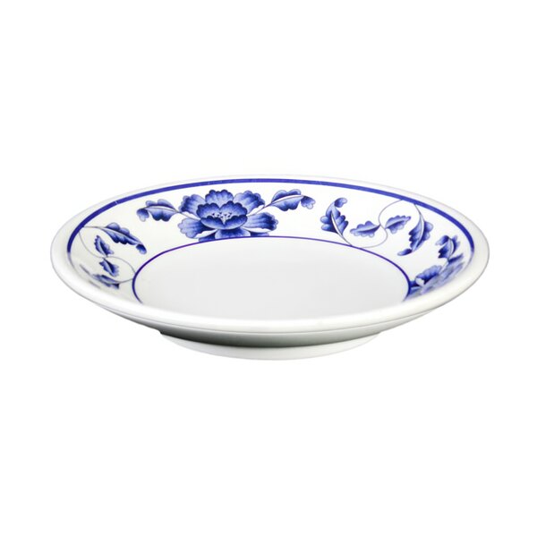 A white plate with blue flowers on it.