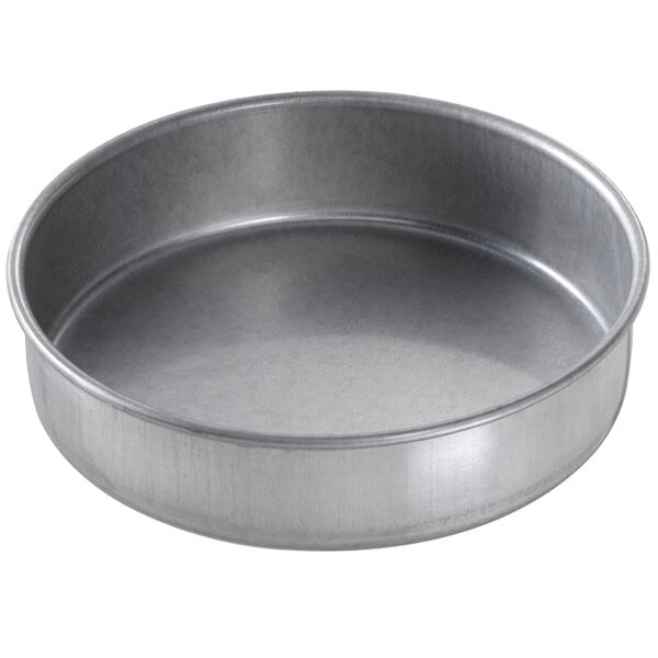 a round metal pan with a white background