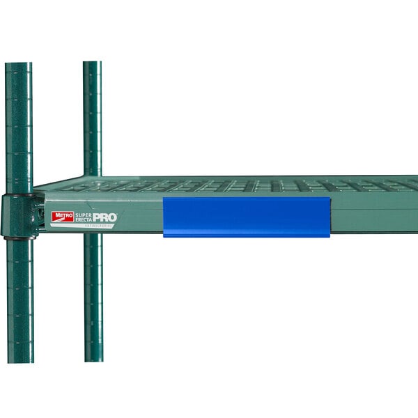 A green metal shelf with blue Metro shelf markers on it.