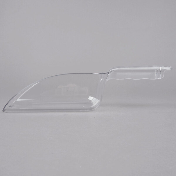 A clear plastic scoop with a handle.