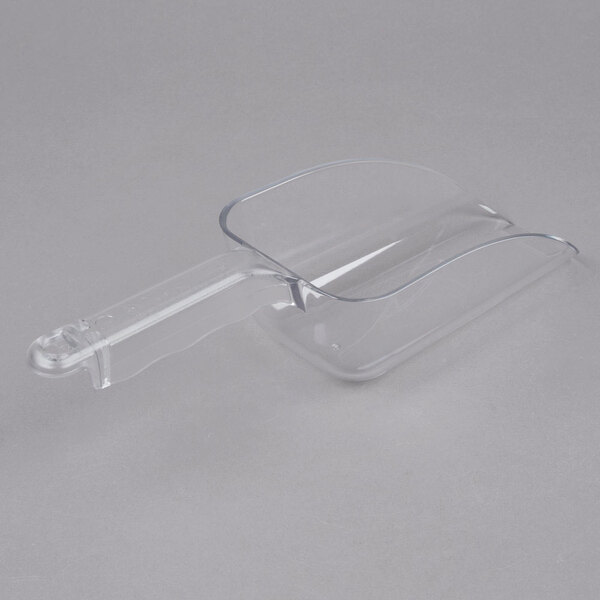 A clear plastic scoop with a handle.