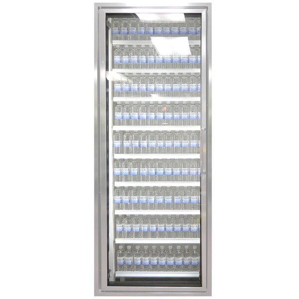 A Styleline walk-in cooler merchandiser door with shelves holding water bottles.