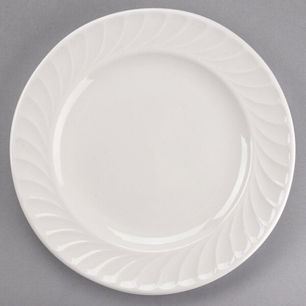 A Tuxton Meridian ivory china plate with a swirl design.