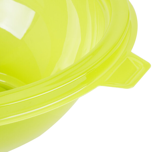 A close up of a green Fineline PET plastic salad bowl.