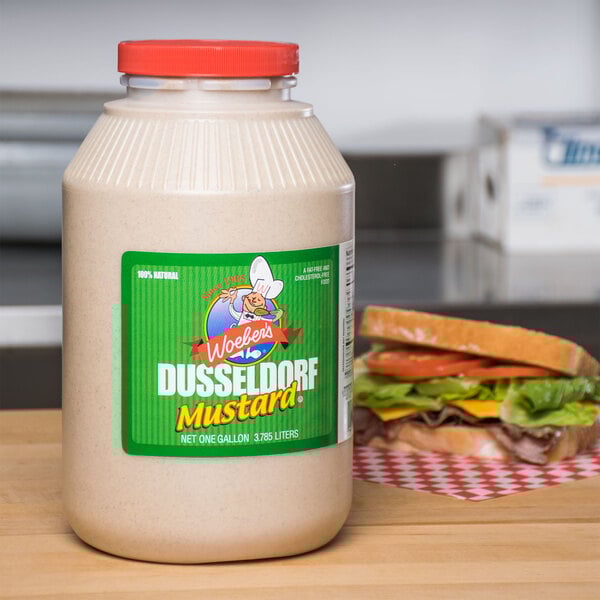 A jar of Woeber's Dusseldorf Mustard on a table.