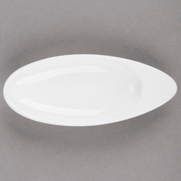 An Arcoroc white porcelain oval dish.