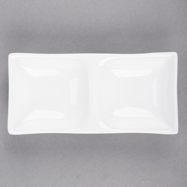 A white rectangular Arcoroc porcelain dish with two compartments.