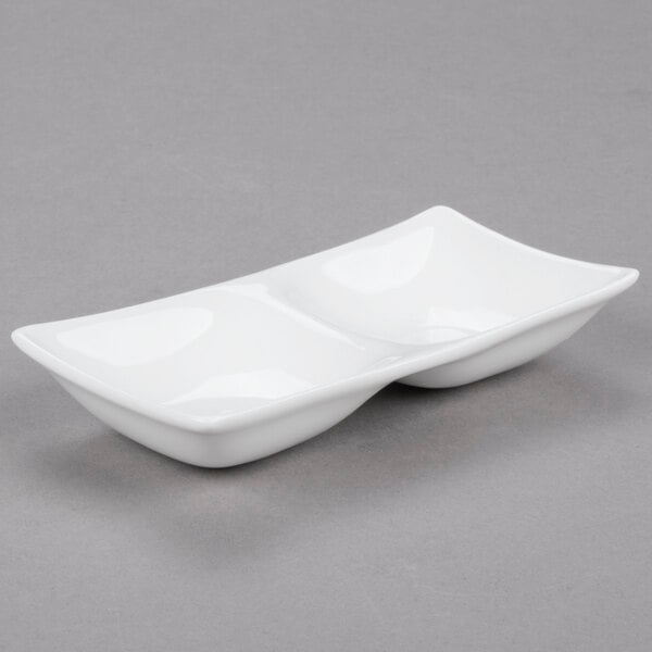 A white rectangular Arcoroc porcelain dish with two compartments.