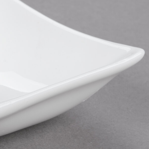 An Arc Cardinal white porcelain dish with two compartments.