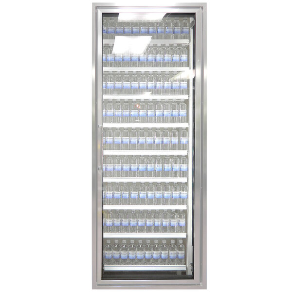 A Styleline walk-in cooler merchandiser door with shelving holding water bottles.