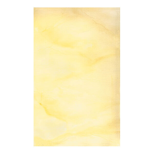A close-up view of a sheet of paper with a light yellow, marbled texture.