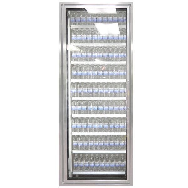 A Styleline walk-in cooler door with shelving filled with water bottles.