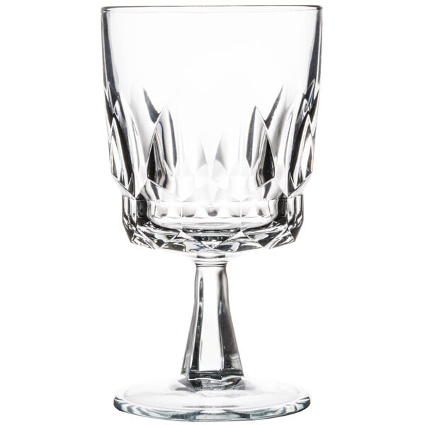 An Arcoroc clear glass wine goblet with a crystal stem.