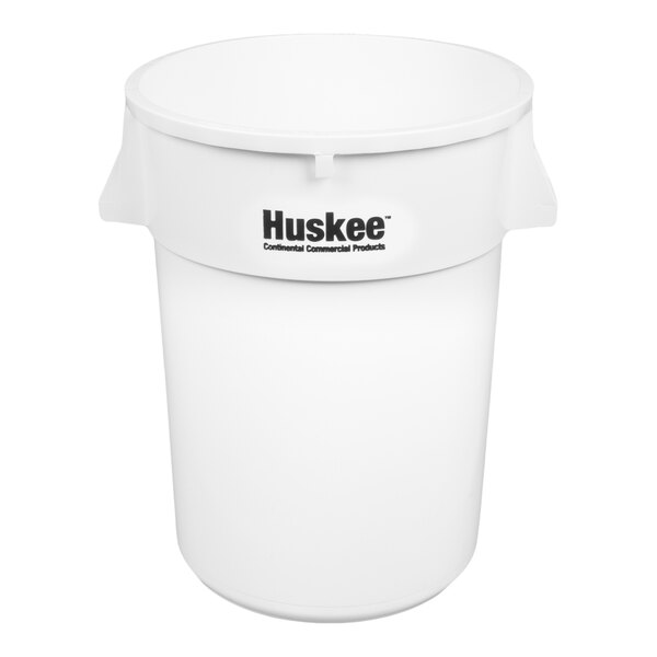 A large white round plastic trash can with handles and the Huskee brand logo on the front.