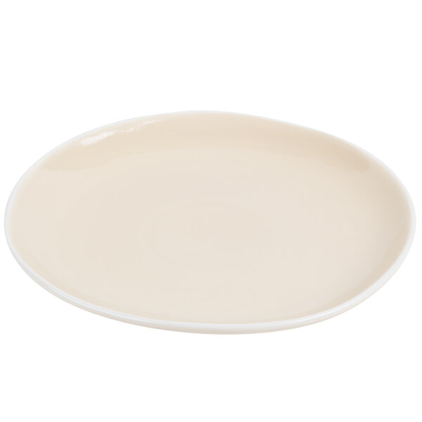 An Arcoroc white porcelain plate with a small rim.