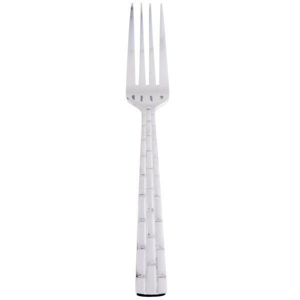 A silver fork with a white handle.