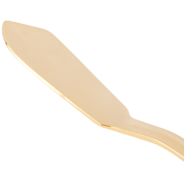 A 10 Strawberry Street Crown Royal gold plated stainless steel butter knife with a gold metal handle.