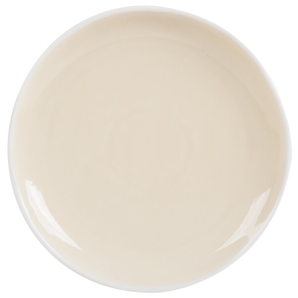 An Arcoroc white porcelain plate with a small white rim.