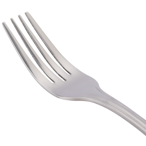 A close-up of a 10 Strawberry Street Lincoln stainless steel dinner fork with three other forks.