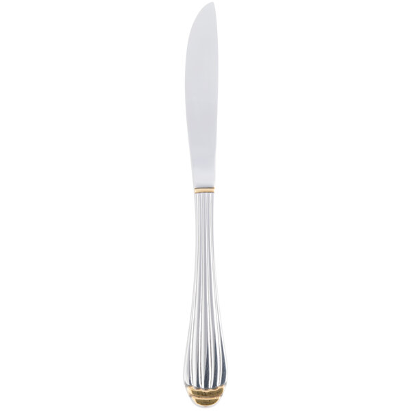A silver knife with a gold handle.