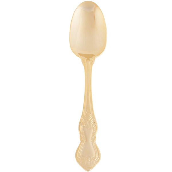 A gold plated stainless steel dinner spoon with a crown design on the handle.