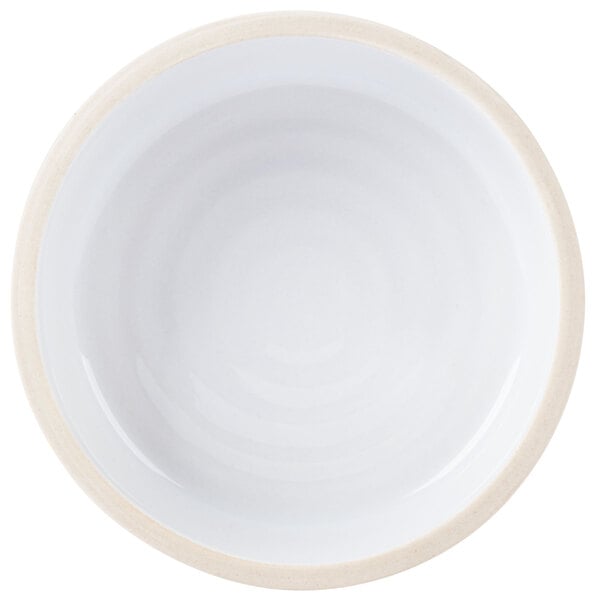 A white Chef & Sommelier bowl with a white rim.