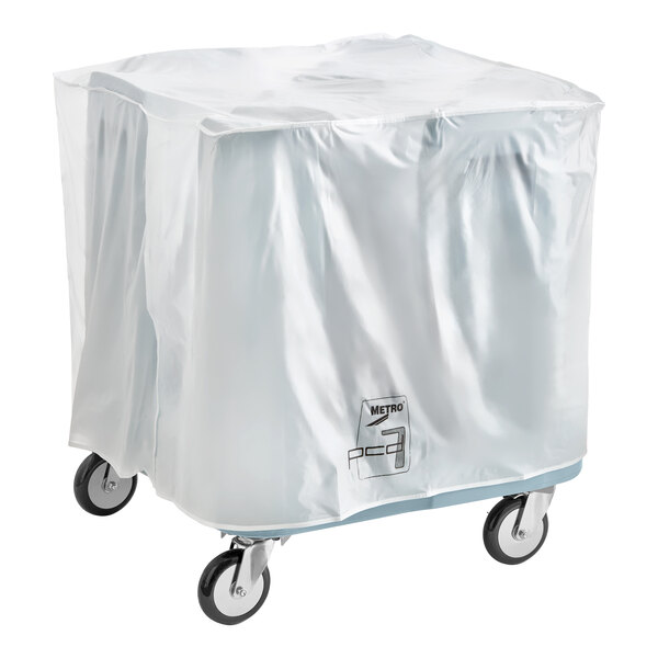 A large dish dolly on wheels covered with a clear plastic cover, designed to hold up to 540 dishes.