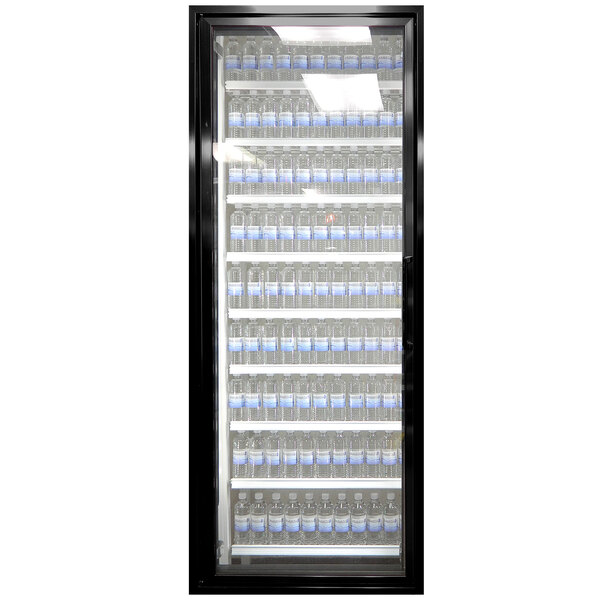 A black Styleline walk-in cooler door with glass shelves holding water bottles.