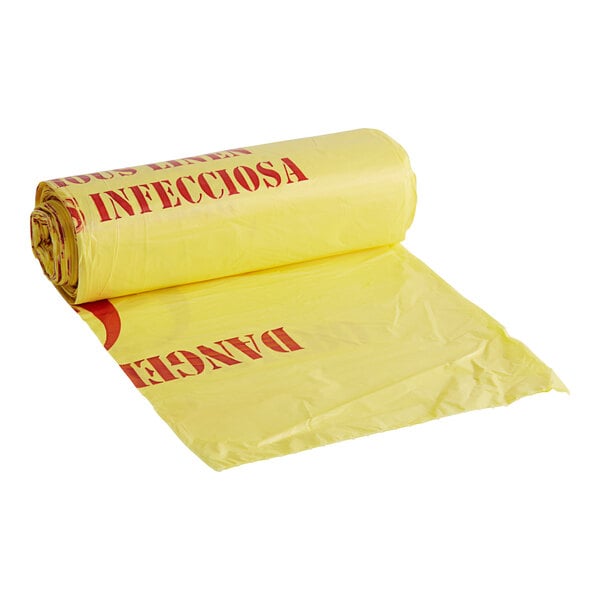 A roll of yellow high density infectious linen medical waste bags with red text.
