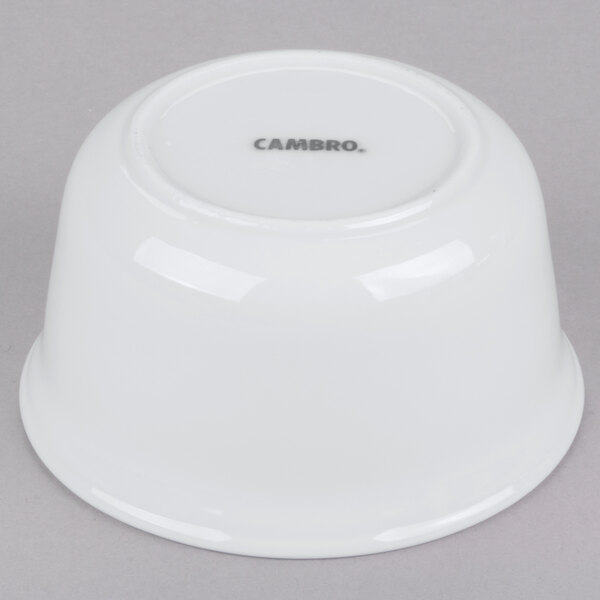 A white Cambro porcelain bowl with black text that reads "Cambro" on the surface.