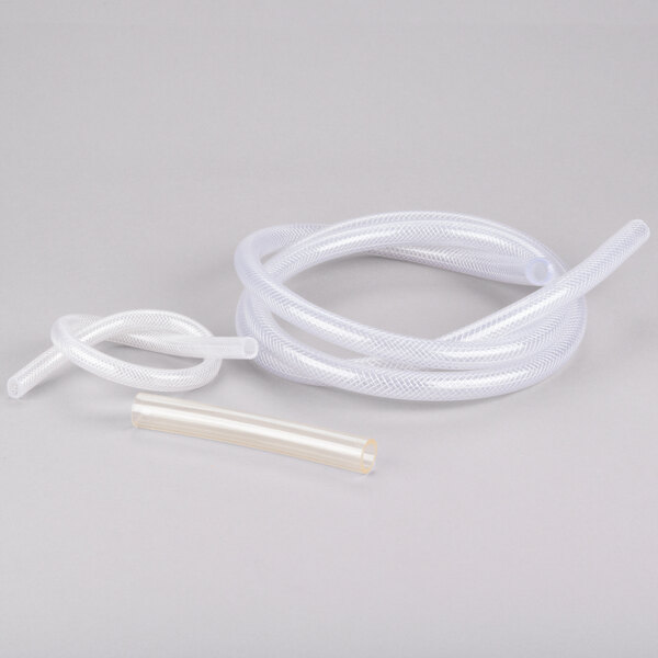 A white plastic tube and a white plastic tube connected to a Hoshizaki condensate drain pump.