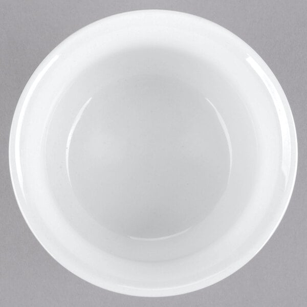 A close-up of a white bowl with a white rim.