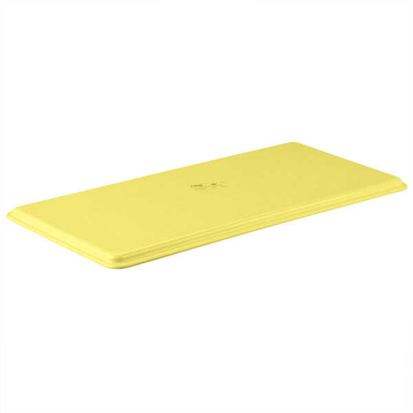 A yellow rectangular MFG Tray with a white logo.