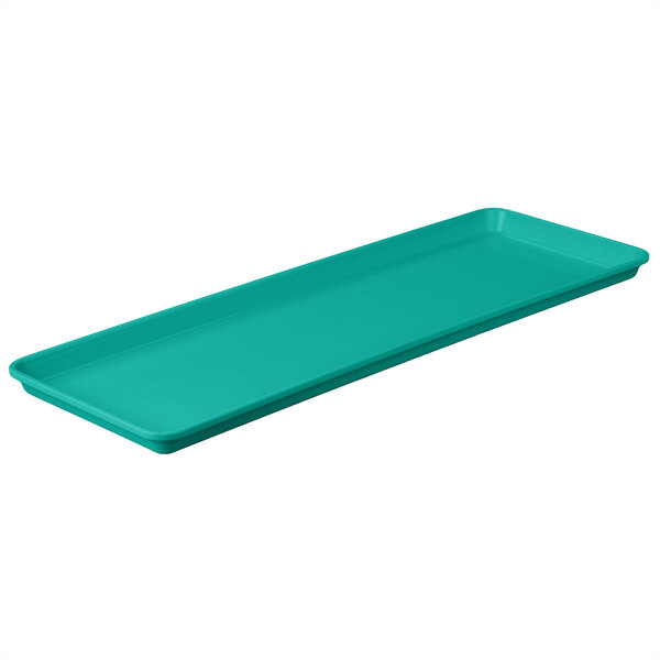 A rectangular mint green MFG Tray with a handle.