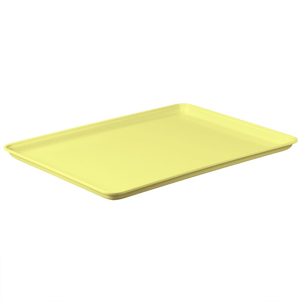 A yellow rectangular MFG Tray bakery display tray.